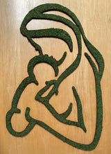 Mother holding baby, decorated with moss on top.