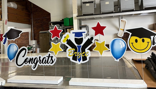 Large Graduation Yard Sign with a custom name on the Graduate