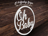 Oh Baby cutout sign placed on top of wood table for event decoration
